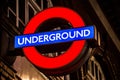 Illuminated London Underground tube sign at night. Royalty Free Stock Photo