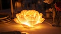Illuminated lotus flower lamp centerpiece on a dining table Royalty Free Stock Photo