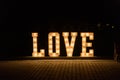 Illuminated Love sign in large letters at a wedding reception