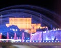 Illuminated main fountain and people`s house Parliament House in Bucharest, Romania, 07.23.2020 Royalty Free Stock Photo