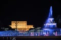 Illuminated main fountain and people`s house Parliament House in Bucharest, Romania, 07.23.2020 Royalty Free Stock Photo