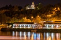 Illuminated marina building with colored reflections in water at night in Prague Royalty Free Stock Photo