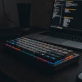 Illuminated Mechanical Keyboard: A Nighttime Coding Setup Royalty Free Stock Photo