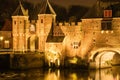 Illuminated medieval gateway Koppelpoort at night, Amersfoort the Netherlands Royalty Free Stock Photo