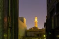 Illuminated minaret of Grand Mosque in Dubai Grand Bur Dubai Masjid at night.