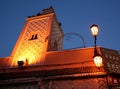 Illuminated minaret on mosque at night