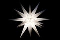 An illuminated Moravian star during Christmas time Royalty Free Stock Photo