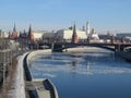 Illuminated Moscow Kremlin and Moscow river in winter morning. Pinkish and golden sky with clouds. Russia Royalty Free Stock Photo