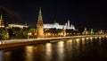 Illuminated Moscow at night with the Moskva River in the foreground and the Kremlin with its wall, towers, church and Royalty Free Stock Photo