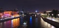 Illuminated Moscow river tonight with nice reflections and historical buildings of Red October chocolate plant