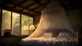 Illuminated mosquito net over bed in the guesthouse Royalty Free Stock Photo