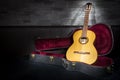 Illuminated music guitar with case in fron Royalty Free Stock Photo