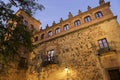 Illuminated narrow streets and Facades of historic houses in Caceres city