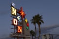 The illuminated Neon Boneyard Park sign designed in a vintage style for the Neon Museum