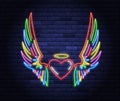 Illuminated neon heart with angel wings and halo Royalty Free Stock Photo