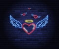Illuminated neon heart with angel wings and halo
