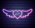 Illuminated neon heart angel wings sign frame light electric banner glowing,black brickwall background.Valentines Day,sex shop,bar Royalty Free Stock Photo