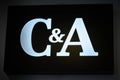 Illuminated neon sign of the clothing company C&A