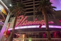 Illuminated neon text on famous restaurant casino in city at night