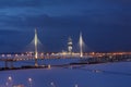 Illuminated at night, cable-stayed highway bridge crosses the ri Royalty Free Stock Photo