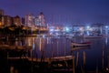 Illuminated night on the riverside in Itajai Santa Catarina Brazil, boats and lights enchant the landscape