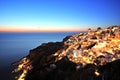 Illuminated Oia Village at Sunset on Santorini Island Royalty Free Stock Photo