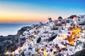 Illuminated Oia Village at Sunset on Santorini Island Royalty Free Stock Photo