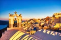 Illuminated Oia Village at Sunset on Santorini Island Royalty Free Stock Photo