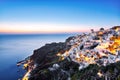 Illuminated Oia Village at Sunset on Santorini Island Royalty Free Stock Photo