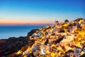 Illuminated Oia Village at Sunset on Santorini Island Royalty Free Stock Photo