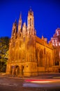 Illuminated old gothic Church in old Town at night Royalty Free Stock Photo