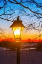 Illuminated old street lamp in winter landscape Royalty Free Stock Photo