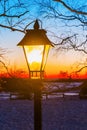 Illuminated old street lamp in winter landscape Royalty Free Stock Photo