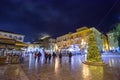 Illuminated old town of Nafplion in Greece with tiled roofs, small port, bourtzi castle, Palamidi fortress at night. Royalty Free Stock Photo