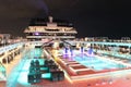 Open deck pool on a cruise ship at night