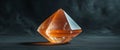 Illuminated Orange Crystal on Dark Background. Royalty Free Stock Photo