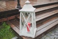 Illuminated outdoor lantern with candle