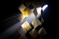 Illuminated paper squares with text hanging in a dark, smoky environment writing document Royalty Free Stock Photo