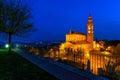 Illuminated parish church under blue morning sky in small italian town. Royalty Free Stock Photo