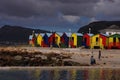 Colourful changing huts on beach at St James Beach, Muizenberg