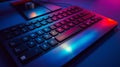 Illuminated pc keyboard by colorful lighting, displaying both Latin and Cyrillic characters Royalty Free Stock Photo