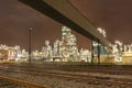 Illuminated petrochemical production plant with train tracks in front, Antwerp, Belgium Royalty Free Stock Photo