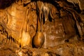 Illuminated picturesque karst rock formations in Balcarka Cave, Moravian Karst, Czech: Moravsky Kras, Czech Republic Royalty Free Stock Photo