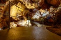 Illuminated picturesque karst rock formations in Balcarka Cave, Moravian Karst, Czech: Moravsky Kras, Czech Republic Royalty Free Stock Photo