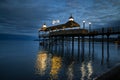 Illuminated pier over the lake at sunset Royalty Free Stock Photo