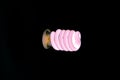 Pink CFL bulb glowing Royalty Free Stock Photo