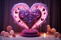 Illuminated pink heart with small hearts on violet stand with ambient candlelight. Love concept