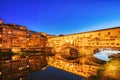 Illuminated Ponte Vecchio Bridge with Reflection in Arno River at Dusk, Florence