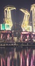 Illuminated port cranes on Lasztownia Island in Szczecin at a foggy night, Poland