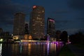 Illuminated Purple Bridge Over River In City Against Sky. Royalty Free Stock Photo